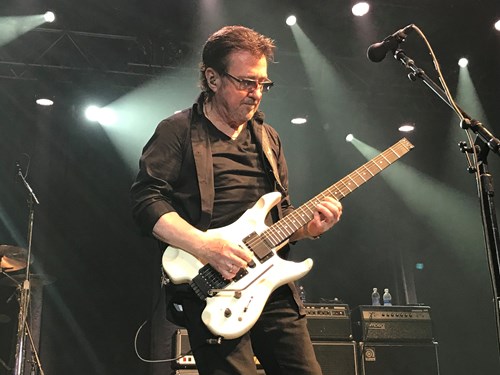 Buck Dharma playing guitar on stage